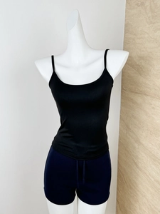 Detail of black slim fit elastic camisole top on mannequin with blue drawstring shorts