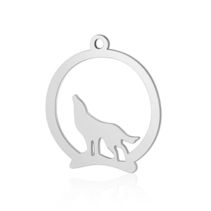 Close-up of a polished stainless steel wolf silhouette pendant over a white background
