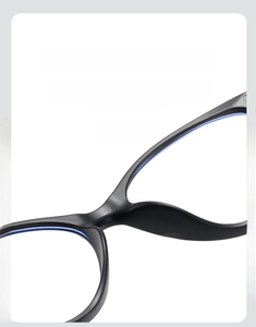 Macro shot of comfortable integrated nose pads on black cat-eye glasses frame