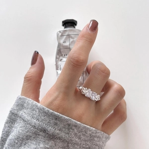 Detailed shot of an irregular S925 sterling silver ring with rectangular zircon and beads