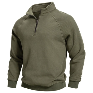 Detail of army green quarter-zip sweatshirt showing ribbed cuffs and stand collar