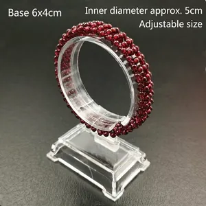 Detail view of red garnet beaded bracelet on an acrylic stand with 5cm diameter specs