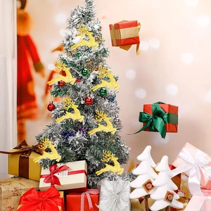 Close-up of golden glitter reindeer ornaments hanging on a festive decorated Christmas tree