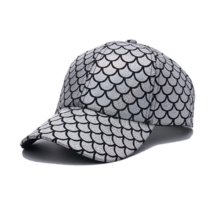 Silver fish scale baseball cap with metallic finish and curved brim in street style