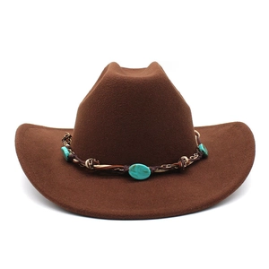 Detail of a dark brown felt cowboy hat featuring turquoise stones on a braided hat band