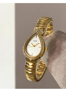 Macro detail of GEDI gold waterdrop watch face with crystals and metallic strap