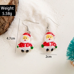 Detail shot of Santa Claus resin earrings showing 4.7cm height and 5.58g weight specs