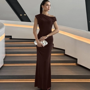 Detail of dark brown off-shoulder ruched dress with slim fit and asymmetric neckline