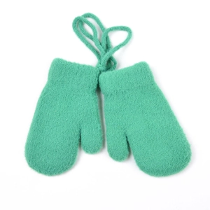 Detail of bright green knitted mittens with security string for toddlers' winter warmth