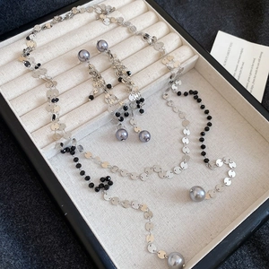 Elegant vintage jewelry set with black beads and gray pearls in a premium gift box