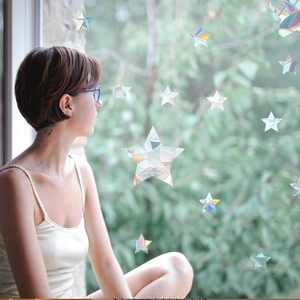 Rainbow prism star window stickers creating colorful light effects with a lifestyle view