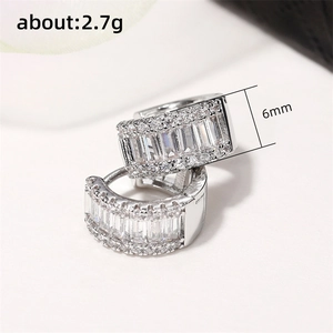 Silver hoop earrings featuring three rows of pave-set cubic zirconia stones, 6mm width