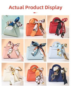 Detail of multi-color mini leather wedding favor bags with decorative silk scarves