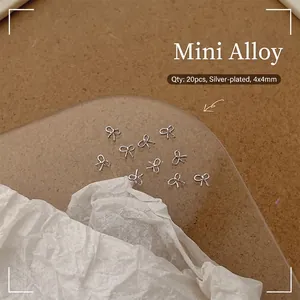 Detailed view of 20pcs silver mini alloy 3D bowknot charms for nail art and DIY decoration