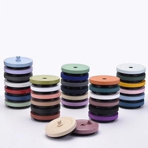Assorted colorful silicone lids for bubble tea cups with straw holes and heart-shaped rings