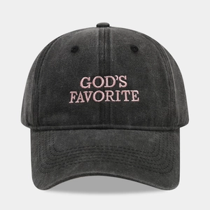 Detailed view of God's Favorite embroidery on a washed grey cotton baseball cap