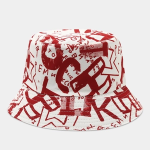 Macro detail of graffiti print pattern on white reversible cotton bucket hat