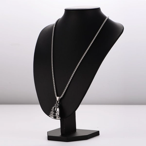 Gothic stainless steel necklace featuring a textured skull bell pendant on a chain