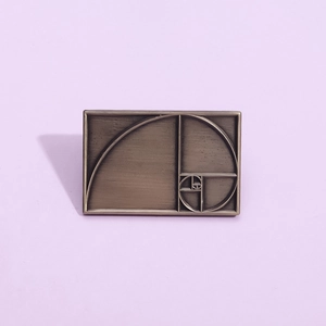 Vintage bronze rectangular brooch with geometric golden ratio Fibonacci spiral design
