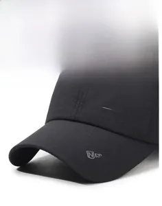 Close-up of quick-dry black baseball cap showing SPORTS embroidery and fine fabric texture