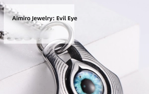Macro shot of stainless steel Evil Eye pendant showing intricate metal textures and blue iris