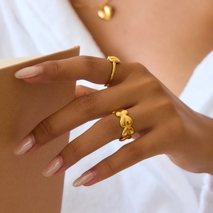 Polished gold stainless steel heart ring set with continuous heart band and thin ring