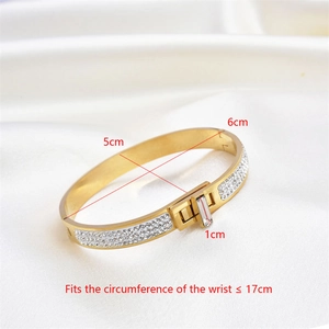 Detailed view of gold oval bangle with pavé crystals and size dimensions marking