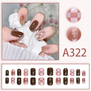Short checkered press-on nails with gold foil accents and caramel brown tones set