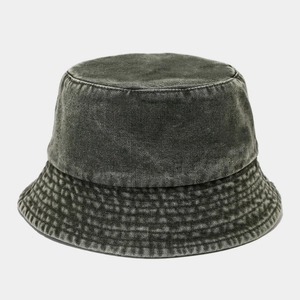 Detailed view of washed denim bucket hat with vintage texture and stitched brim detail