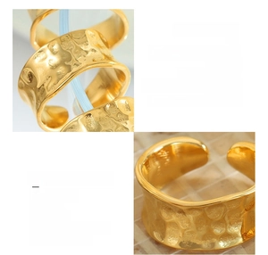 Macro detail of 18K gold plated titanium steel ring with textured honeycomb surface