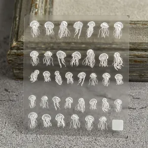 5D embossed nail stickers featuring white jellyfish patterns for ocean themed nail art
