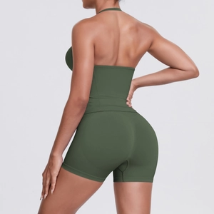 Detail view of seamless dark green yoga set featuring racerback top and high-waist shorts