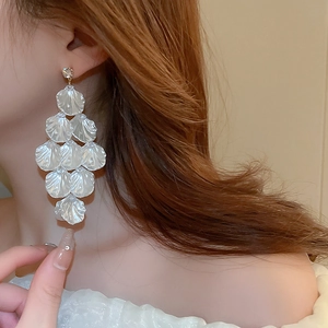 Elegant tiered faux shell flower drop earrings with a pearlescent finish and studs