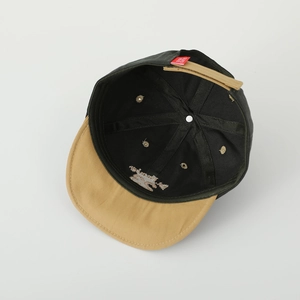 Internal view of toddler baseball cap featuring 6-panel stitching and adjustable back strap