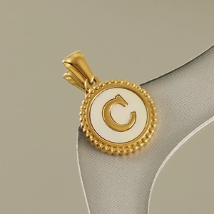 Golden 18K stainless steel round pendant featuring a white shell inlay and letter C engraving