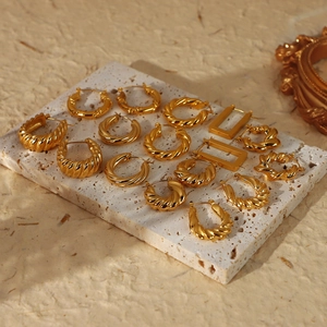 Chunky gold-plated stainless steel croissant hoop earrings in various twisted geometric styles