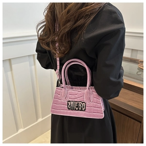 Detail of purple crocodile texture handbag with unique ZMIEBO letter embroidery patch