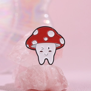 Cute cartoon red mushroom enamel pin on a pink crystal base with a dreamlike background