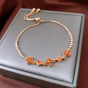 Vintage 18K gold plated bracelet with orange clover charms and adjustable pull chain