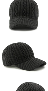 Detailed views of black knit baseball cap showing thick cable knit texture and ribbed brim