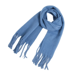 Close-up of soft blue mohair scarf fabric texture with delicate tassel fringe detail
