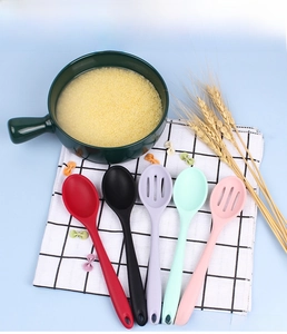 Detailed set of colorful silicone kitchen spoons including solid and slotted versions