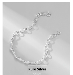 Close-up of S925 pure silver twisted links and spring clasp on minimalist bracelet