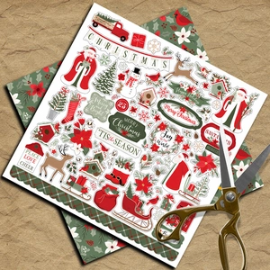 Close-up of vintage Christmas scrapbooking paper with Santa and golden scissors detail
