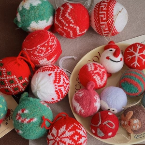 Assorted knit and felt Christmas tree hanging ornaments in red, green, and white