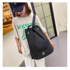 Detail of black waterproof Oxford backpack with a dedicated bottom shoe compartment