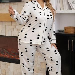 Women's plus size waffle knit pajama set with heart pattern and black piping details
