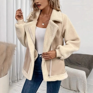 Detail of faux shearling collar and suede texture on beige women's biker jacket