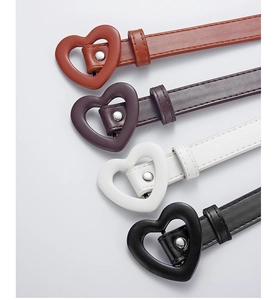 Detail of colorful children's PU belts featuring heart-shaped buckles and neat stitching
