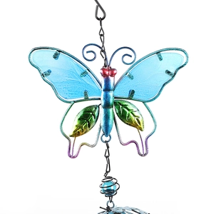 Detailed view of hand-painted blue glass butterfly ornament with metal wire frame